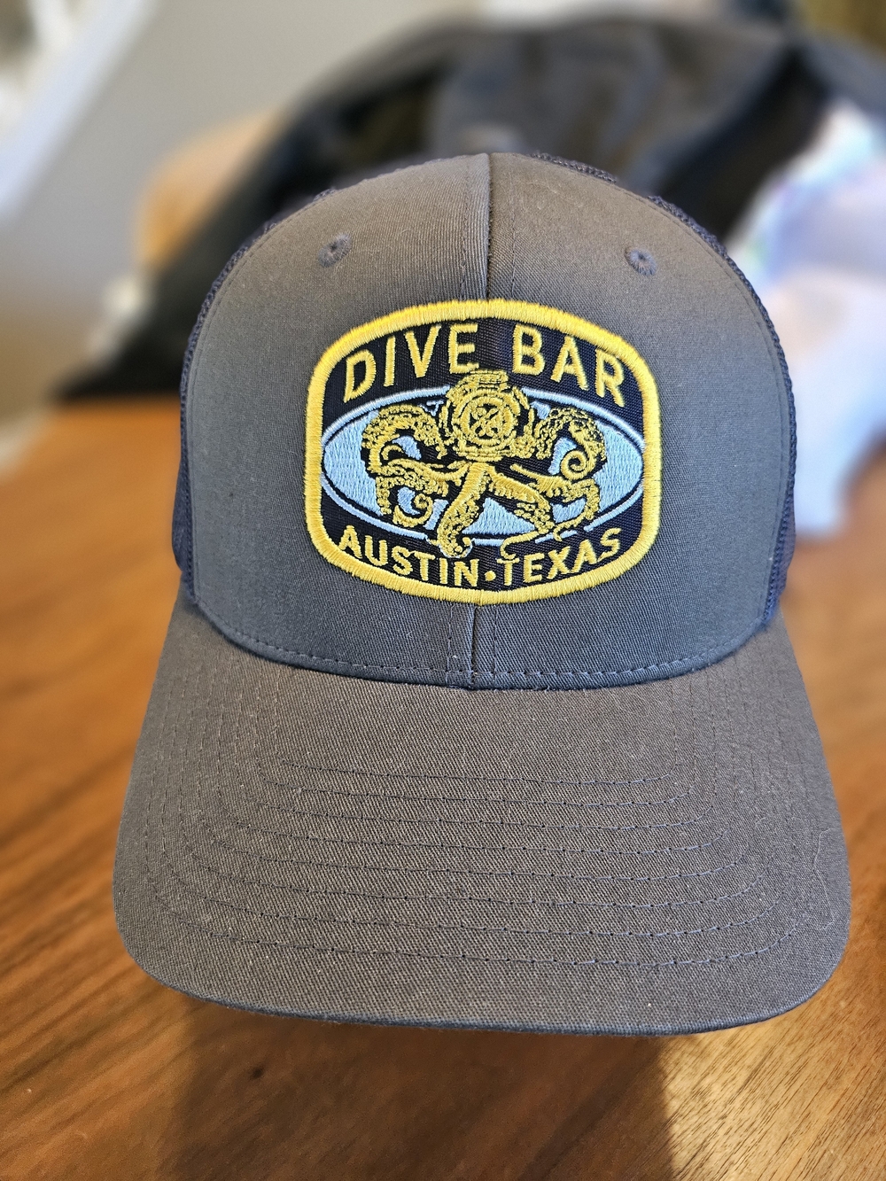 The Classics Yupoong Mesh Trucker Cap Dive Bar, Austin TX Navy Embroidered Patch